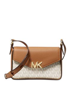 A chic silhouette accented with an MK logo, the Sylvia messengeris a petite way to carry your essentials.Small sized bag; 8-1/4"W x 5-1/2"H x 3-1/2"D (width is measured across the bottom of handbag)24-1/2"L adjustable strapFlap with magnetic closureGold-tone hardwareInterior back zip pocket & front slip pocketColor: Vanilla Coated Canvas Satchel With Logo, Crossbody Shopping Bag With Logo, Logo Shoulder Bag For On-the-go, Logo Crossbody Satchel For Travel, Elegant Logo Bags For On-the-go, Classic Bags With Logo For On-the-go, Daily Use Crossbody Bag With Logo, Modern Pouch Bag With Logo, Travel Satchel Bag With Logo