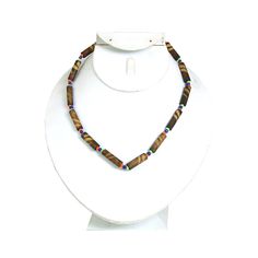 Simple and elegant, this Set of 6 Bamboo Choker Necklaces makes an elegant and authentically African addition to any ensemble. The chocker-style necklaces are made of oblong bamboo beads that have striated brown and tan patterns and are connected by round beads of various sizes and colors. With a set of six bamboo choker necklaces, you can wear one and share the others. Get them all today! Made in Kenya Bamboo Beads, Ankh Necklace, African Jewelry, Trade Beads, African Wedding, Choker Necklaces, West Africa, Wedding Necklace, Kenya