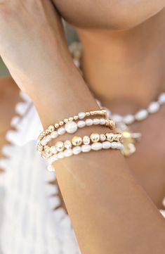 Stack on the shine with this party-ready bracelet set illuminated by cultured freshwater pearls and 18-karat gold-plated beads. Set includes four bracelets Pearl size: 4-6mm Cultured freshwater pearl/18k-gold plate Imported Pearl Bracelets With Spacer Beads, Pearl Bracelet With Spacer Beads, Pearl Bracelet With Gold Beads And Round Beads, Party Pearl Bracelet With Gold Round Beads, Party Pearl Bracelet With Gold Beads, White Stackable Pearl Bracelet, Stackable White Pearl Bracelet, Hand-strung Gold Bracelets For Festive Occasions, Festive Gold Hand-strung Bracelets