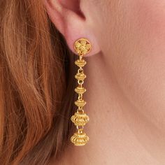 A fabulous long stud drop  gold earring with an antique flavour, but a contemporary elegant subtle boho look.  All the materials I use are real Sterling Silver and 18 carat gold. I do not use inferior metals such as Gold fill or Brass Gold plated! Each gold bead is handmade using a filigree technique, and is a nod to a romantic Byzantine or ethnic culture.  We have graduated the size of the beads to create a more glamorous and subtly elegant style. They swing beautifully as you move and bring an air of freedom and joy to the wearer. These fab gold earrings cross over from a boho to an elegant and antiquey style and weve used matt gold which shines a lovely light on the face. Great for a celebration, wedding or party, going out on the town, a gift for your girlfriend or just for you! Light Turkish Gold Jewelry, Gold Long Earrings, New Necklace Designs, Real Gold Earrings, Stud Drop Earrings, Earrings Cross, Gold Dangle Earrings, Filigree Earrings, Gold Earrings Designs