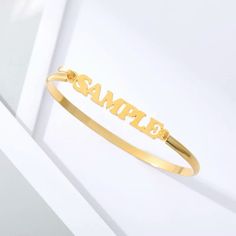 Lets make our lives more beautiful with custom/personalized items. This can bring you a lot of joy when you see your name or your loved once name on the item. Having your personal touch on a piece of jewelry really makes a difference. Item:- Name Bangle Bracelet Metal:- Stainless Steel Finished:- Platinum-Gold-Rose Gold Bracelet Size:- 145 MM Please Explain your Name and Font No. On Personalization Box. Like This- Abdul. Font #1 Processing and shipping: 2-3 weeks is processing times and once shi Custom Name Charm Bracelet For Personalized Gift, Customized Name Bracelet As Personalized Gift, Customizable Friendship Bracelet Jewelry, Adjustable Gold Bracelet With Custom Name For Personalized Gift, Custom Name Bangle Bracelet For Personalized Gift, Nameplate Bracelets For Friendship, Customizable Letter-shaped Bracelets For Gifts, Nameplate Bracelet For Friendship, Friendship Nameplate Bracelets With Name Detail