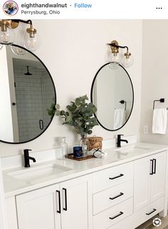 a bathroom with two sinks and mirrors on the wall