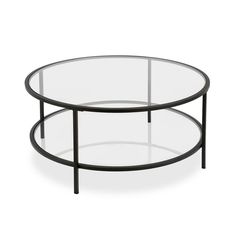 two round glass tables with metal legs and black bases, one is on top of the other