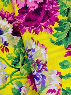 the fabric is bright and colorful with flowers on it