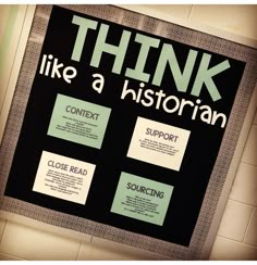 a poster on the wall that says think like a historian next to it is informational