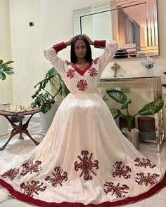 This shimena Ethiopian dress is an absolute showstopper, with its vibrant red color and intricate Tilf design. Made from high-quality fabric, this dress feels soft and comfortable against the skin, while the tailored fit flatters your curves and adds a touch of elegance to the traditional design. The Tilf embroidery on the neckline and sleeves is a true work of art, showcasing the skill and craftsmanship of Ethiopian artisans. The dress is made of menen fabric. The dress is perfect for special o Eritrean Dress, Habesha Dress, Ethiopian Traditional Dress, Ethiopian Women, Ethiopian Dress, Habesha Kemis, Wedding Dress Chiffon, Addis Ababa, Cultural Events