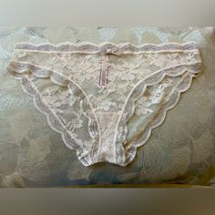 Dream Angels By Victoria Secret Cheekini. Size: Xl. Color: Ivory Lace With Beautiful Silver Shimmer. Matching Bra Sell Separately . Never Worn. Feminine Beige Bottoms With Delicate Lace, Feminine Pink Bottoms With Delicate Lace, White Feminine Lace Bottoms, Feminine Lace Lounge Bottoms, Cream Lace Brief Bottoms, Victoria's Secret Sheer Fitted Bottoms, Feminine Sheer White Bottoms, Fitted Sheer Bottoms By Victoria's Secret, Victoria's Secret Elegant Summer Bottoms