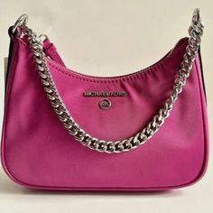 Michael Kors- Nwt Jet Set Charm Small Satchell Pink And Silver Purse Deep Fuchsia. Super Cute Small Purse Perfect For Everyday. Has Room Inside For Cards And Belongings. Full Zipper Closure With Sleek Outside Material And Silver Chain Handle. Shoulder Bag Silver-Tone Hardware 7.75”W X 5.75”H X 2.75”D Handle Drop: 8.5” Interior Details: 3 Card Slots Lining: 100% Polyester Zip Fastening Imported" Style Tags: Trendy Trending Viral Popular Bags Purses Small Purse Small Bag Lightweight Bag Accessorie Cute Small Purse, Silver Purse, Popular Bags, Bag Silver, Pink And Silver, Lightweight Bag, Small Purse, Kors Jet Set, Bags Purses