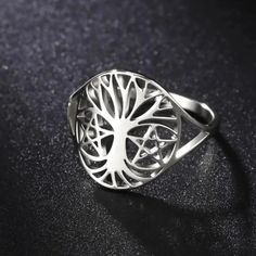 🌳 Looking for a unique and meaningful piece of jewelry? Check out our Pagan Tree of Life Ring! 🌿 Made from high-quality stainless steel, this ring won't rust or cause allergies. It's also resistant to acid and alkali, ensuring its durability for years to come. Plus, the color won't fade or deform over time. Get yours today and embrace the power and beauty of the Tree of Life. 🌺 Minimalist Stainless Steel Round Ring, Unique Stainless Steel Promise Ring, Symbolic Jewelry With Steel Shank As Gift, Hypoallergenic Stainless Steel Promise Ring, Symbolic Jewelry As A Gift, Durable Symbolic Jewelry As A Gift, Adjustable Silver Titanium Rings, Round Minimalist Titanium Jewelry, Minimalist Round Titanium Jewelry