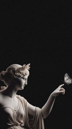 a statue holding a butterfly in its hand