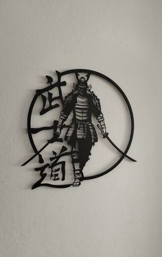 a metal clock with an image of a samurai on it