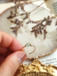 ✨ Dainty Light Green Jade Ring for Women ✨14K Gold Filled, Rose Gold Filled, Sterling Silver Wire Wrapped Tiny gemstone Ring💚 Simple stackable ring with a genuine green Jade, the good-luck stone. Jade is believed to bring protective, lucky-charm energy to the wearer 💚Sizing:• Gemstone Diameter: 4 mm• Ring Band: 0.8 mm • Handmade in your ring size with natural gemstone beads. • Dainty & cute. The ring is slim and petite, yet durable to wear daily. • Gold-filled is known for its lasting quality. 14k Gold Filled Round Band Jewelry Gift, Handmade 14k Gold Filled Rings, Handmade 14k Gold Filled Jewelry For Promise Ring, Dainty Tiny May Birthstone Jewelry, Adjustable Round Emerald Birthstone Ring, Adjustable Round Emerald Ring As Birthstone, Everyday Jade Gemstone Jewelry, Adjustable 14k Gold Filled Rings As Gift, Adjustable 14k Gold Filled Rings For Gifts