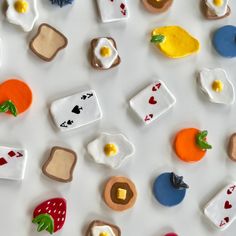 many different types of cookies on a white surface