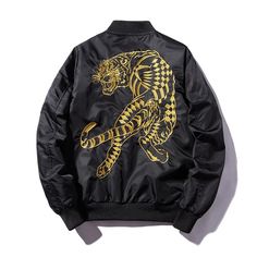 Our Tiger Bomber Jacket – a fierce and fashionable addition to your wardrobe that combines style with a bold statement. *Jacket runs small so take a look at our sizing guidelines Key characteristics of this distinctive piece: Striking Tiger Embroidery: The jacket features a meticulously embroidered tiger motif, adding a bold and eye-catching element to your outfit. Versatile Bomber Silhouette: Designed with a classic bomber jacket silhouette, offering a versatile and contemporary look suitable f Pilot Jacket, Fashion Stand, Style Japonais, Cooler Look, Flight Jacket, Embroidered Jacket, Short Jacket, Outerwear Coats, Black Jacket