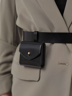 Made in a modern and minimalist aesthetic, the Micro Belt Bag is not only a fashion accessory but also a functional one. Although small, the stylish bag can hold your keys, coins or other small items. With its versatile design, the leather belt bag can be worn with a sporty jumpsuit for an edgy outfit or with a blazer for a chic, elegant look. Bag Size: Height- 7 cm, Width- 8 cm, Depth – 1.5 cm Waist belt width: 3 cm Adjustable using the buckle Designed to be fitted on the waist Unique Bags Design, Waist Bags For Women, Waist Bag Leather, How To Tie Shoes, Edgy Outfit, Waist Purse, Collection Ideas, Soft Leather Handbags, Micro Bag