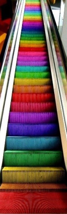 an escalator with many colors on it