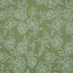 the fabric is green with white flowers on it