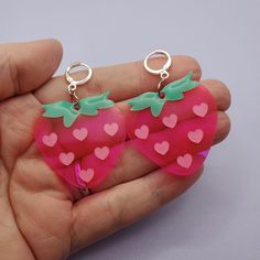 Neon pink strawberries with pink and green details. I make these lightweight earrings with leverback clasps so everyone can wear them - they're small enough for regular ear piercings and they work well with tunnels if you have stretched lobes!  I am selling these as I make them - I am not doing custom orders. Fun Pink Jewelry With Lobster Clasp, Pink Novelty Jewelry With Lobster Clasp, Novelty Pink Jewelry With Lobster Clasp, Playful Pink Earrings For Valentine's Day, Nickel-free Pink Earrings For Everyday, Novelty Pink Nickel-free Earrings, Nickel-free Pink Novelty Earrings, Playful Pink Heart Earrings For Gift, Small Pink Earrings For Gifts