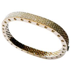 This stunning two section 18 karat Yellow gold bangle style bracelet is accented with 171 carefully matched white round brilliant diamonds weighing approximately 4.16 carat total. Inspired by art and fashion, Novel Collection is presenting its creativity and superlative craftsmanship. Absolutely unique pattern is reproduced in a retro design; easy to wear and highly versatile, this elegant concept will touch your essence. This piece was Hand made at the Novel Collection Jewelry Atelier, specializes in rare collectible pieces in Fancy color diamonds. Please inquire for additional details. We also have stock of other investment pieces which are unlisted. Kindly send us a message and we will be glad to respond with the piece that meets your description. Novel Collection is a recognized leader Jewelry Atelier, Pave Bangle, Diamond Bangle Bracelet, Retro Bracelet, Yellow Gold Bangle, Diamond Bangles Bracelet, Diamond Supply, Bangles Style, Unique Diamonds