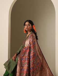 Introducing the Chidiya Banarasi Silk Collection, a celebration of elegance and tradition in the world of Indian textiles. Crafted with meticulous attention to detail, each piece in this collection showcases the timeless beauty of Banarasi silk adorned with intricate Chidiya (bird) motifs. Drawing inspiration from nature's grace, the Chidiya Banarasi Silk Collection offers a stunning array of sarees, dupattas, and garments, reflecting the rich heritage of Varanasi's weaving tradition. Immerse yo Traditional Semi-stitched Salwar Kameez With Zari Weaving, Ceremonial Tussar Silk Kurta With Traditional Drape, Raw Silk Anarkali Set For Traditional Ceremonies, Ceremonial Salwar Kameez With Cutdana For Transitional Season, Festive Jamawar Anarkali Set With Dupatta, Bollywood Brocade Anarkali Set With Dupatta, Diwali Raw Silk Meenakari Sets, Festive Raw Silk Set With Meenakari Details, Ceremonial Tussar Silk Kurta For Transitional Season