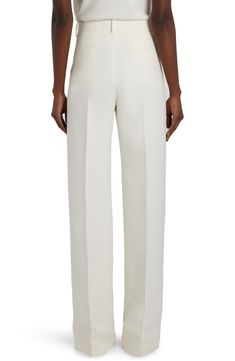 Widened legs add to the perfect drape of creamy-colored pants expertly tailored in a blend of virgin wool and soft silk. 36" inseam; 20" leg opening; 12" front rise; 14" back rise (size 42) Zip fly with hook-and-bar closure Front slant pockets; back welt pockets 65% virgin wool, 35% silk Dry clean Made in Italy Designer Clothing Uzun Boy, Silk Wide Leg Pants, Silk Outfit, Colored Pants, Welt Pockets, Valentino Garavani, Leg Pants, Wide Leg Pants, Designer Clothing