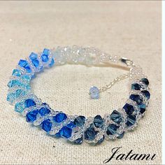 a bracelet with blue and clear glass beads