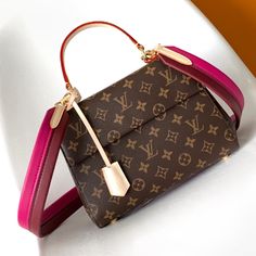 This Cluny BB handbag is made of classic Monogram canvas, designed for busy life. The wide opening is framed by a trim interior for easy access. The magnetic flap and zipped interior pocket keep items safe and secure. The colorful leather shoulder strap adds vigor to the crossbody, and the top handle allows for elegant carrying.

Size: 28.0 x 20.0 x 10.0 cm (LxHxW)
• Monogram coated canvas
• Calfskin trim
• Textile lining
• metallic parts
• Magnetic lid closure
• key case
• Interior pat Shopping Flap Bag With Top Handle In Monogram Canvas, Designer Monogram Canvas Flap Bag With Top Handle, Designer Monogram Canvas Top Handle Flap Bag, Designer Top Handle Flap Bag In Monogram Canvas, Monogram Canvas Flap Shoulder Bag With Removable Pouch, Brown Monogram Canvas Flap Bag With Removable Pouch, Monogram Canvas Shoulder Bag With Removable Pouch, Monogram Canvas Satchel Shoulder Bag With Top Handle, Daily Use Monogram Canvas Flap Bag With Removable Pouch