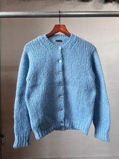 "1960s blue knit cardigan. Good vintage condition.  18\" Pit to pit  22\" Length All sales final, please ask any questions before buying. Thanks!" Light Blue Crew Neck Cardigan For Winter, Blue Wool Cardigan With Buttons, Light Blue Buttoned Winter Sweater, Light Blue Buttoned Sweater For Winter, Light Blue Winter Sweater With Buttons, Fitted Light Blue Winter Cardigan, Fitted Light Blue Cardigan For Winter, Winter Light Blue Button Sweater, Blue Fitted Wool Sweater