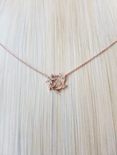 "Simple Dainty Leaf Wealth Wrap Necklace Chain Length: 15\" Chain Extension: Yes Chain Extension Length: 2\" Clasp: Yes Type of Clasp: Lobster Claw Pendant Length: 1/2\" Pendant Width: 1/2\" Chain Width: 1 mm Weight: 2g Metal: Rhodium or gold plated chains, Rhodium plated pendant, Tarnish resistant Material: Crystal" Rose Gold Jewelry Necklaces, Rose Gold Jewelry Set Simple, Diamond Chains Women Simple, Rose Gold Clavicle Chain Necklace With Flower Pendant, Rose Gold Necklace With Flower Pendant And Delicate Chain, Rose Gold Crystal Necklace With Clavicle Chain, Rose Gold Flower Pendant Clavicle Necklace, Rose Gold Clavicle Chain Crystal Necklace, Dainty Rose Gold Necklace With Rose Design