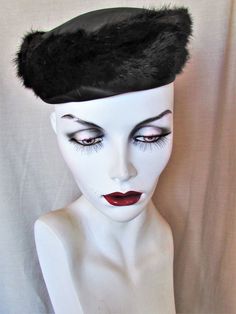 "MINK PILLBOX HAT Furs were very fashionable in the 1960's and mink ended up on everything from coats and hats to cufflinks. This is a mid-century icon--the pillbox hat, made elegant in mink. It is a black dark dark brown mink, a black satin crown and rim around the bottom of the ring of fur. Good vintage condition. There is a dab of glue left from where netting was attached. Priced accordingly. Inside rim 21\" Height 2 1/2\"   SHIPPING NOTES -Domestic shipping is Priority for items over 1 lb. - Vintage Winter Cloche Hat For Formal Occasions, Vintage Mini Hats For Evening In Winter, Vintage Winter Formal Cloche Hat, Dark Dark Brown, 1960s Hats, Mid Century Fashion, Satin Noir, Pillbox Hat, Vintage Hats