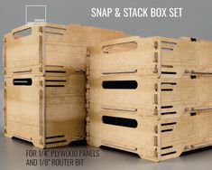 two wooden crates with black handles are stacked on top of each other and the bottom is open