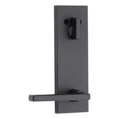 an image of a door handle on a grey door frame with black handles and knobs