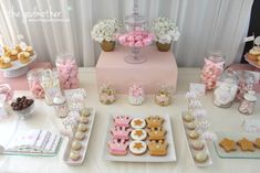 a table topped with lots of desserts and cookies