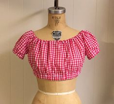 This is a 1940s reproduction custom made peasant blouse, just like the one your grandmother used to wear.  It is a beautifully made short sleeve crop top with elastic around the armhole openings and under the bust.  There is also adjustable elastic around the neckline, so you can wear it lose to show your shoulders or wear it tight to cover them.  The Lucy peasant blouse is made from 100% preshrunk cotton, perfect for those hot summer months.The Lucy peasant blouse pairs perfectly with the Lola Tap Shorts, Feedsack Fabric, Short Sleeve Crop Top, Short Sleeve Cropped Top, How To Make Shorts, Peasant Blouse, Crop Blouse, Summer Months, Tie Top