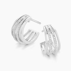 SKU# E-10651 Diamond Weight 0.10cts Earring Length 13.80 mm Width 8.80 mm Thickness 1.60 mm. Post back closure Finish 14k gold plated sterling silver or in sterling silver. Avoid contact with anything containing derivatives of alcohol. Silver Pierced Huggie Diamond Earrings, Diamond Huggie Earrings With Polished Finish, Silver Huggie Diamond Earrings, Pierced, Diamond White Huggie Earrings In Sterling Silver, Classic Huggie Cubic Zirconia Earrings, Classic Cubic Zirconia Huggie Earrings For Pierced Ears, Classic Huggie Earrings With Cubic Zirconia, Modern Round Cubic Zirconia Huggie Earrings, White Gold Huggie Earrings With Cubic Zirconia