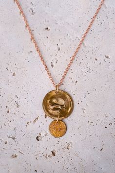 Details Tarnished brass with a vintage personality with two brass disks on two delicate chain styles of tiny copper and brass links. Brass 15-18" L (adjustable) Bronze Coin Pendant Necklace, Adjustable Yellow Gold Coin Necklace, Nickel-free Gold Coin Necklace, Nickel Free Gold Round Disc Coin Necklace, Nickel-free Gold Round Disc Coin Necklace, Long Gold Necklace With Oxidized Finish, Gold Oxidized Finish Long Necklace, Bronze Oxidized Brass Necklace, Gold Medallion Coin Necklace In Brass