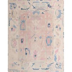 an antique rug with blue and pink colors