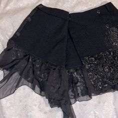 Blayde Italian Designer Unique Wrap Miniskirt Women’s Size 6/Medium (It 42) Wool With Black Sequins And Faux Tar(?) Embellishments Skirts By Blayde Typically Fit True To Size Brand New With Tags-Unworn, New/Nwt Msrp $665 Black 100% Wool Skirt Unlined Four Button Closure - 1 Interior, 3 At Edge Of Wrap Belt Loop Holes (Did Not Come With A Belt) Black Sequins And Beads Minimal Silver Thread As Accent With Beading. Tar- Looking, Shiny Material Painted Onto Skirt (I Know That Does Not Sound Appealin Aztec Print Skirt, Crinkle Skirt, Cute Mini Skirt, Night Skirt, Silk Mini Skirt, Mini Wrap Skirt, Belted Mini Skirt, Cream Skirt, White Denim Skirt