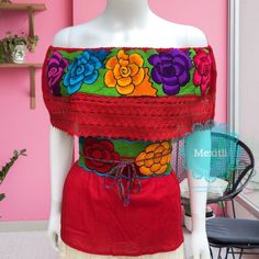 "Mexican Off shoulder top with colorful floral embroidery. Made out of corrugated manta, 100% cotton. Please note: each piece is unique, the embroidery on the top and belt may be slightly different from the one pictured. Dimensions: Small/ Medium Bust- 42\" Length- 22\" Large/ XL Bust- 47\" Length- 23\" 🧵Made in Chiapas, Mexico. 🧺Care Instructions: We recommend hand washing, lay flat to dry. 📲Please feel free to message me with any questions regarding sizing and fit. 📷Additional photos can b Multicolor Tops For Cinco De Mayo Festival, Multicolor Top For Cinco De Mayo Festival, Red Floral Embroidered Top For Festival, Multicolor Floral Embroidered Peasant Top, Red Tops With Floral Embroidery For Festivals, Red Folk Style Top With Floral Print, Multicolor Floral Embroidery Peasant Top, Multicolor Folk Tops For Cinco De Mayo, Folk Style Multicolor Tops For Cinco De Mayo