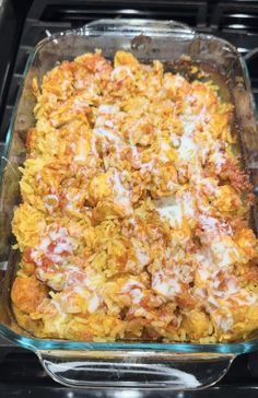 a casserole dish with meat and cheese in it on the stove top, ready to be eaten