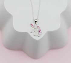 Popular sterling silver unicorn necklace is accented with sparking pink CZs and floats on a 14" Italian chain with high-quality durable lobster clasp. Perfect gift for those girls who love unicorns! This magical unicorn charm is accented with sparkling pink CZs for that bling they love. Matching bracelet and earrings available as well. Perfect gift for your little mystical girl! What a special keepsake gift for toddlers, little girls and children! Necklace comes in beautiful gift box that kids l Personalized Pink Sterling Silver Charm Necklaces, Pink Sterling Silver Charm Necklaces, Pink Sterling Silver Personalized Charm Necklace, Personalized Pink Sterling Silver Charm Necklace, Pink Sterling Silver Charm Necklace, Hypoallergenic Pink Sterling Silver Necklace, Pink Sterling Silver Charm Necklaces With Lobster Clasp, Nickel-free Pink Sterling Silver Charm Necklaces, Adjustable Pink Sterling Silver Charm Necklaces