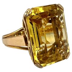 An 18 karat (18K) yellow gold Retro cocktail ring, set with an emerald-cut citrine measuring 19.8 x 14.8 x 9.0 mm with an approximate weight of 18.87 carats to an arching filigree style mount. The shank of the ring is stamped with the dog mark for Moroccan manufacture and 18 karat gold after 1925. Ring size: 7 (US), N.5 (UK) Dimensions: 2.05 x 1.56 x 3.2 cm Weight: 11.14 grams Retro Cocktail, Butterfly Fashion, God Pictures, Cocktail Ring, Cocktail Rings, Emerald Cut, Rings Statement, Luxury Jewelry, Ring Set