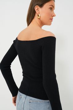 A luxuriously soft wardrobe staple, the Black Knit Nicola Top is exactly what you'll want to wear on your next date night. The wide V-neckline allows you to show some skin while remaining chic and sophisticated, and that fabulous ribbed knit material with a hint of stretch and compression will have you looking and feeling your best. Done in a classic black hue for styling versatility, we love pairing this number with denim, mini skirts, and more for a timeless look you're sure to get some compli Chic Knit V-neck Sweater With Ribbed Neckline, Fitted Ribbed V-neck Knit Top, Elegant Ribbed Knit Top For Winter, Ribbed Off-shoulder Fitted Sweater, Fitted Ribbed Off-shoulder Sweater, Elegant Stretch V-neck Sweater For Winter, Chic V-neck Party Sweater, Fitted Ribbed Tops For Evening, Fitted Ribbed Evening Tops