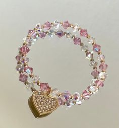 Made with 6mm pink high end crystals and 6mm clear ab swarovski crystal rondelle. Such a stunning piece for any occasion. Cheap Crystal Bracelet With Heart Beads For Women, Cheap Pink Crystal Bracelets, Cheap Crystal Heart Beads Bracelet As Gift, Cheap Pink Chain Bracelet For Gift, Cheap Pink Romantic Beaded Bracelets, Elegant Luxury Pink Beaded Bracelets, Adjustable Pink Crystal Bracelet With Sparkling Stones, Pink Crystal Bracelet With Rhinestones, Gold Crystal Heart Bracelets