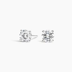 Claw Prong Round Diamond Stud Earrings. A beautifully matched pair of round diamonds are secured in an elegant, open basket with claw prongs. Earrings with a total carat weight of 1.00 carat or over will receive a guardian backing and earrings with a total carat weight under 1.00 carat will receive a push backing. Round Diamond Stud Earrings, Round Cut Diamond Earrings, Diamond Earrings Studs Round, Claw Prong, Diamond Stud Earrings, Diamond Stud, 3 Carat, Accessories Jewelry Earrings, Round Earrings