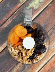 a food processor filled with raisins, carrots and other foodstuffs