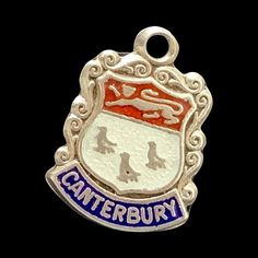 "A Vintage 925 Sterling Silver and Enamel Shield Charm For The English Town Of Canterbury Vintage Shield Charms - the perfect addition to your travel charm bracelet collection.  these picturesque little charms are highly collected and serve as are a reminder of cherished travel memories  Measuring  approximately  - 5/8\" long including the suspension bale By 3/8ths of an inch  wide. It Weighs 1.Gram - and is stamped on the reverse - Silver A Lovely Collectable Vintage Charm that's In Good Condition -  Thank You So Much For Looking Please Do Not Hesitate To Contact me if you have any questions." Travel Charm Bracelet, English Town, 1970s Jewelry, Travel Charms, Travel Memories, Canterbury, Bracelet Collection, Vintage Charms, Silver Charms