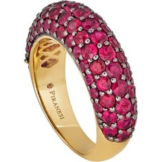 Looking for a statement piece that will turn heads? Look no further than this stunning Small Dome Ring in Ruby by Piranesi. With approximately 3.0 carats of round rubies, this ring is sure to catch the eye of anyone who sees it. The rubies are set in a unique combination of 18K yellow and black gold, creating a bold and elegant contrast that is truly one of a kind.Not only is this ring a beautiful piece of jewelry, but it also speaks to the desires of our target market. Women who buy fine jewelr Luxury Ruby Jewelry With Pave Setting, Luxury Ruby Halo Ring, Luxury Ruby Ring With Vvs Clarity, Luxury Ruby Ring With Pave Setting, Yellow Gold Ruby Rings With Pave Setting, Luxury Pink Sapphire Ring With Pave Setting, Luxury Red Ring With Pave Setting, Luxury Ruby Ring With Multi-stone Round Cut, Luxury Multi-stone Round Cut Ruby Ring