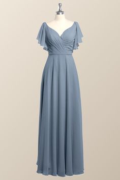 a blue dress on a mannequin dummy with the back draped over it's shoulders