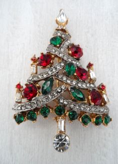 (eBay) Find many great new & used options and get the best deals for VINTAGE 1960'S SIGNED PELL CHRISTMAS TREE PIN W/RED GREEN & CLEAR RHINESTONES at the best online prices at eBay! Free shipping for many products! Vintage Christmas Jewelry For Celebration, Vintage Christmas Celebration Jewelry, Christmas Broaches, Christmas Nostalgia, Christmas Tree Shape, Tree Jewelry, Vintage Rhinestone Jewelry, Jewelry Christmas Tree, Antique Christmas Ornaments